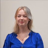 Headshot of Issy Woods.